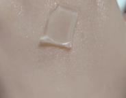IAS-SDC-50 film formation experiment — cured polymer film shown on smooth surface demonstrating uniform film formation and optical clarity after cure cycle